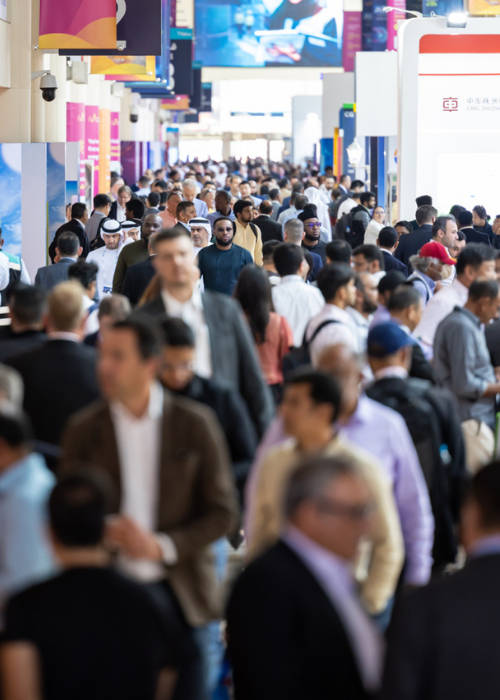 Attendees around an exhibition stand