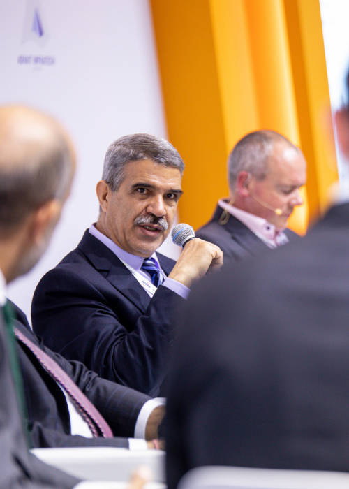 Attendees around an exhibition stand