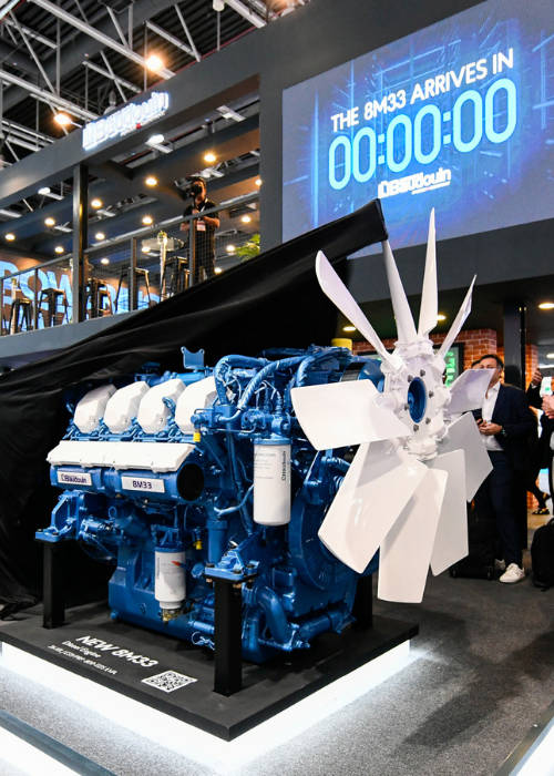 Attendees around an exhibition stand